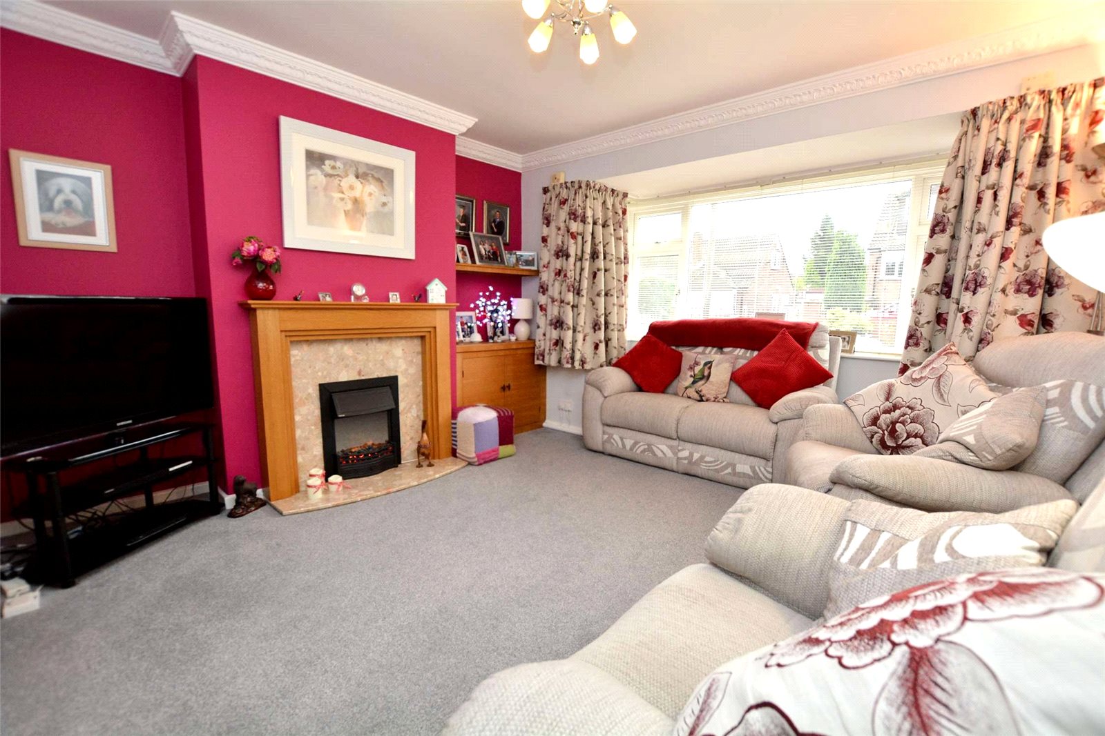 Property for sale in Pudsey, interior reception room. Two large sofas and fireplace