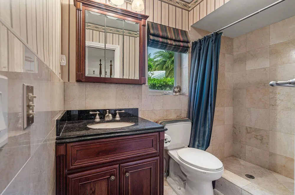 57 Cayuga Rd, Sea Ranch Lakes, FL 33308