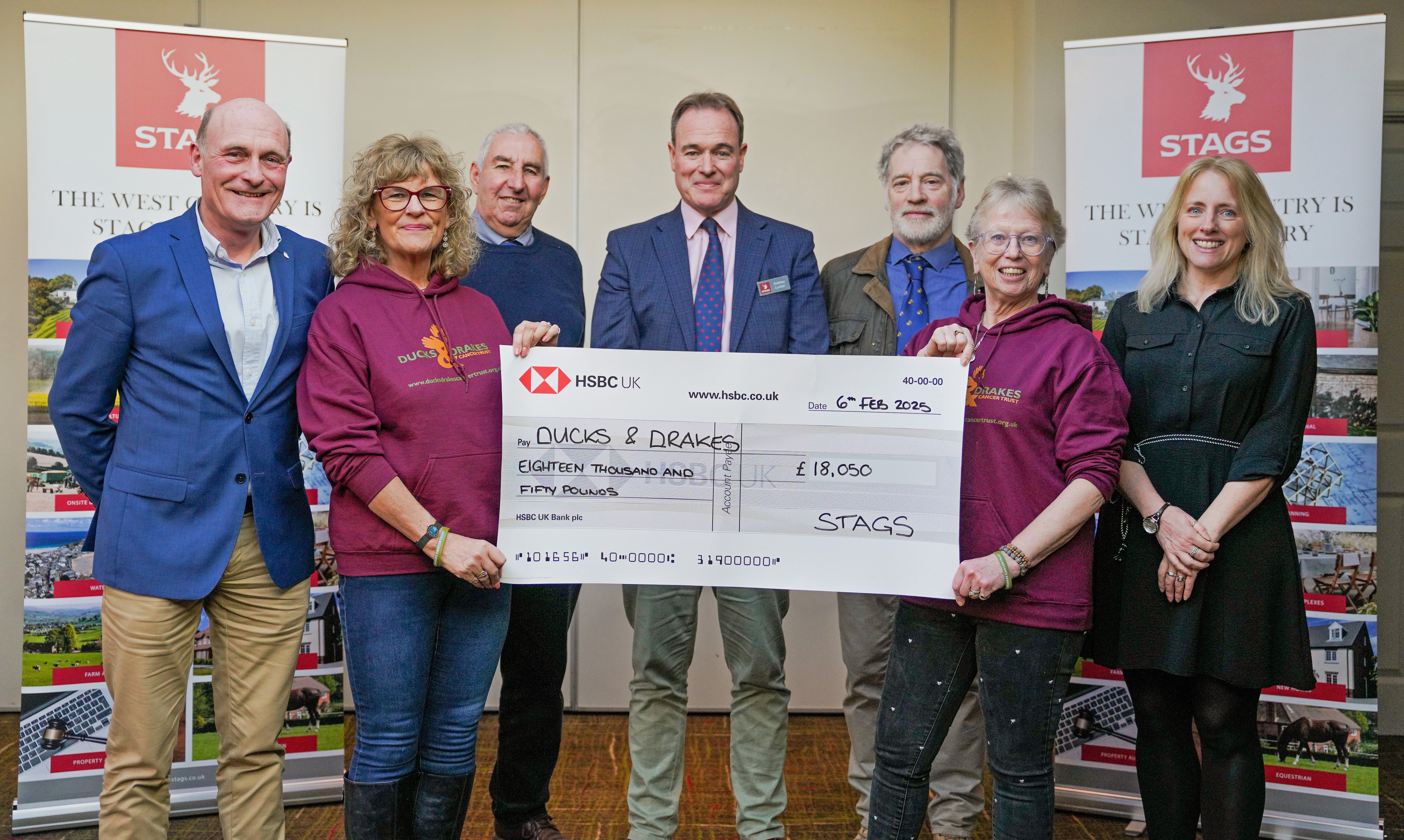 Ducks and Drakes Cancer Charity accepting the fundraising cheque from Martin, our Stags Bridport Office and Sales Manager, and Andrew, Stags Partner.