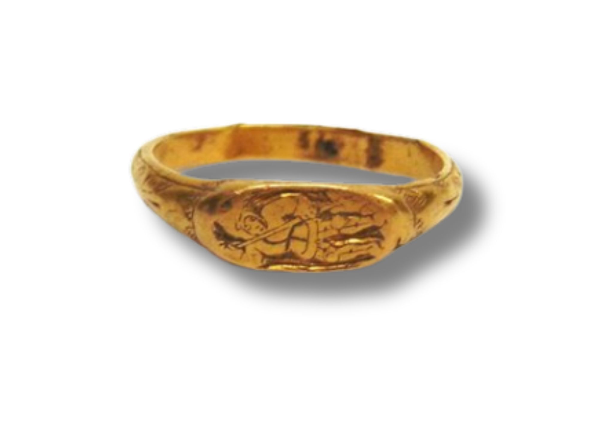 A gold ring with an engraved depiction of St George and the dragon, dating from the Medieval period.