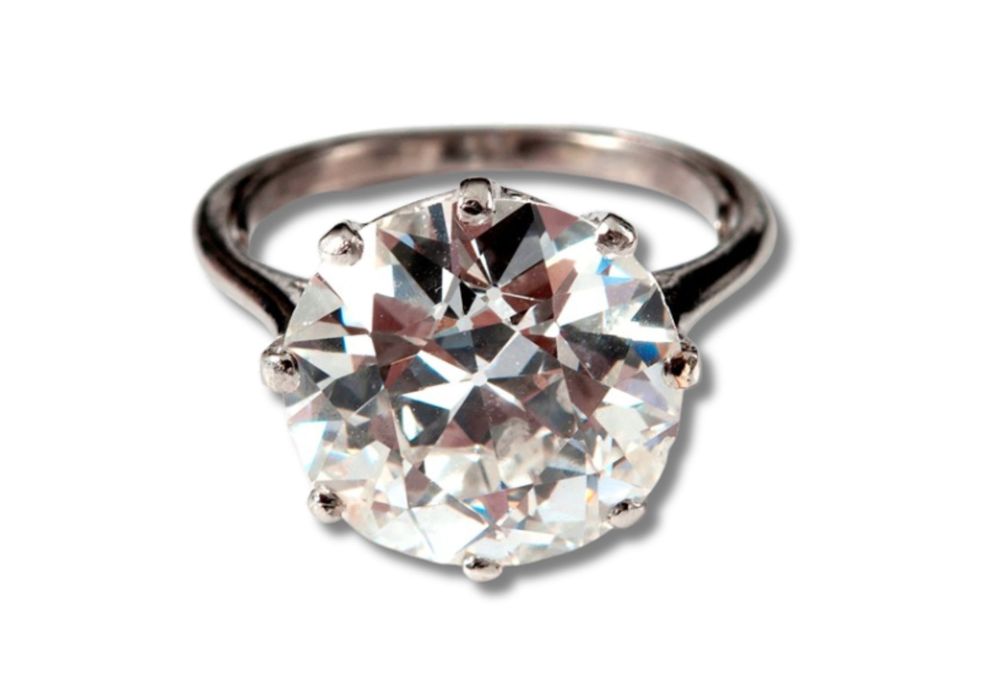 A nine carat white gold ring, with a claw set round European cut stone.