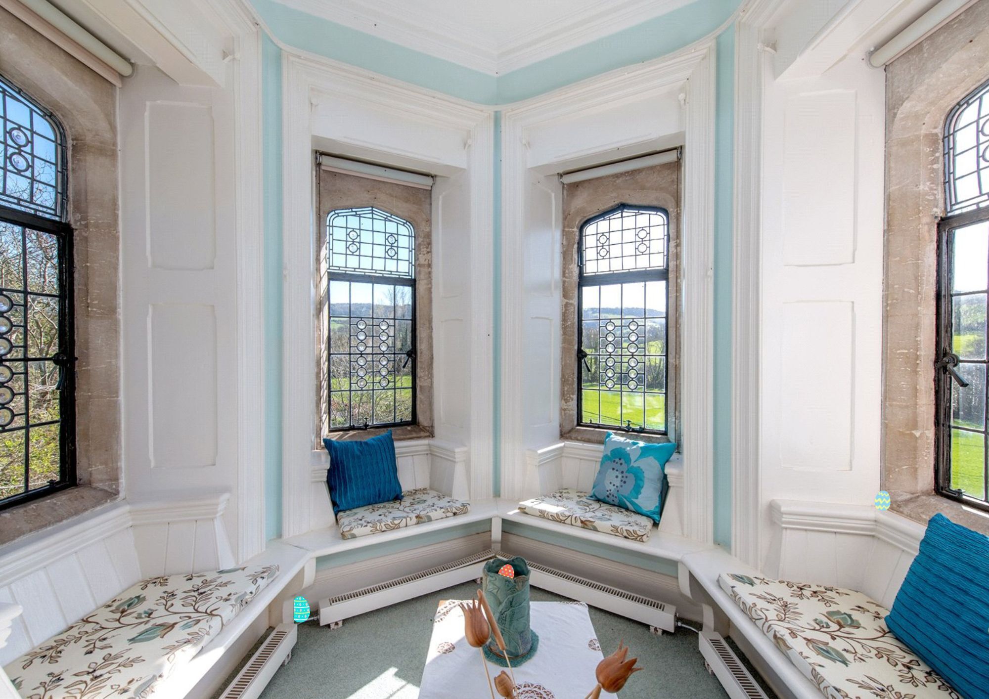 Angled room with window seating and period details