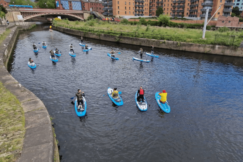 Paddle-boarding on Leeds canal at the docks