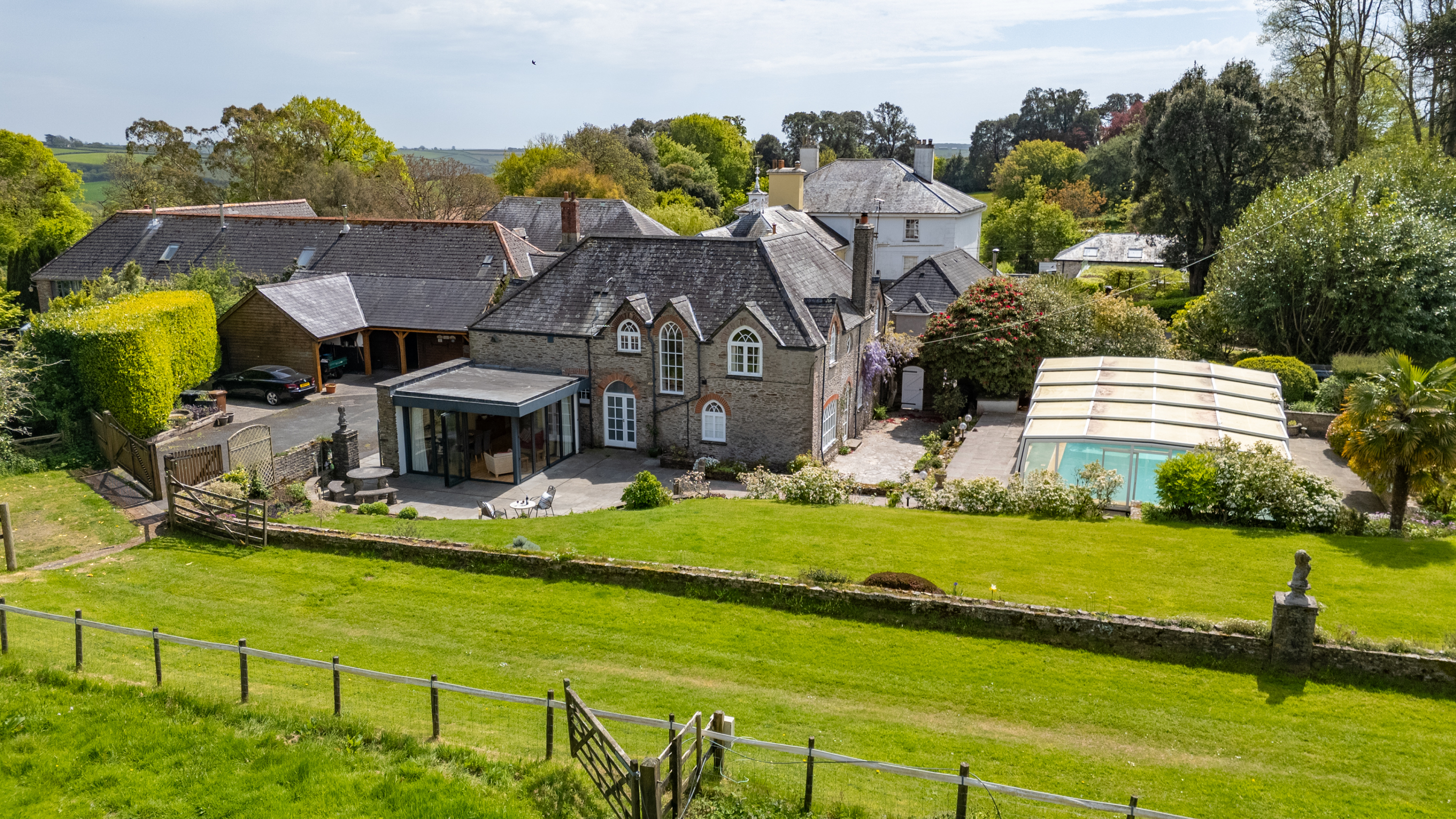 Aerial shot of country estate with swimming pool