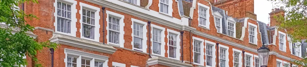 Banner image of a row of properties in central London