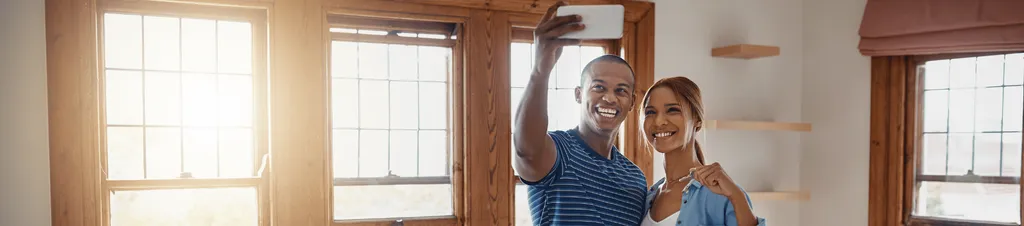 Image of couple moving into their first home